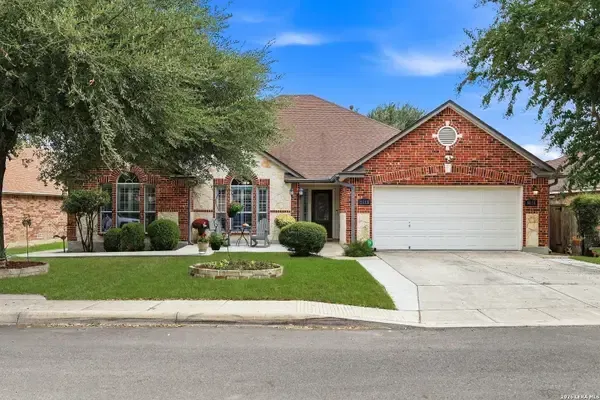Brick home with a landscaped front yard
