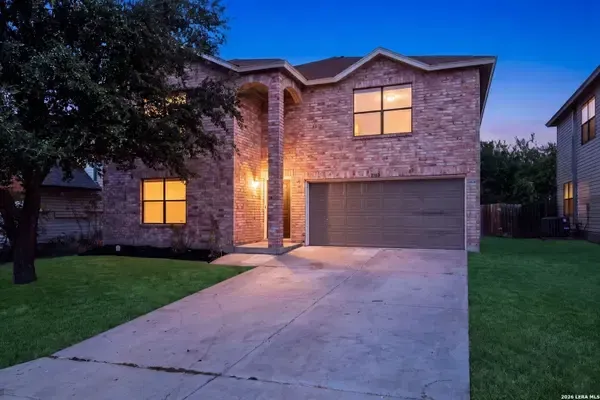 Texas home glowing at dusk
