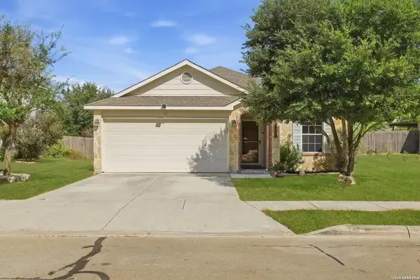 Light stucco home with a two-car garage